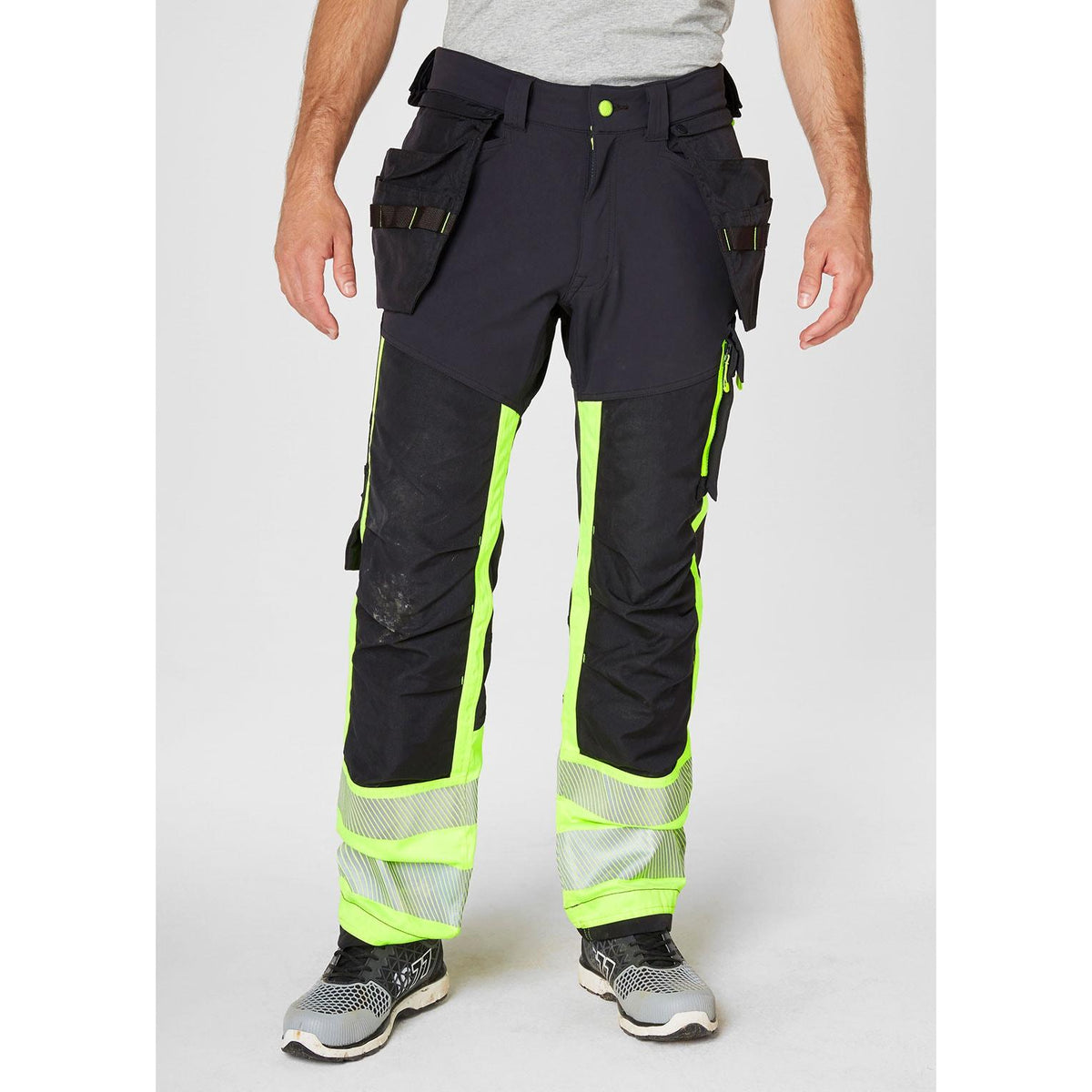 Helly Hansen Work Wear Icu Huomio Riipputaskuhousut 1 Lk. keltainen/harmaa Kestava neljaan suuntaan joustava kangas nayttaa
