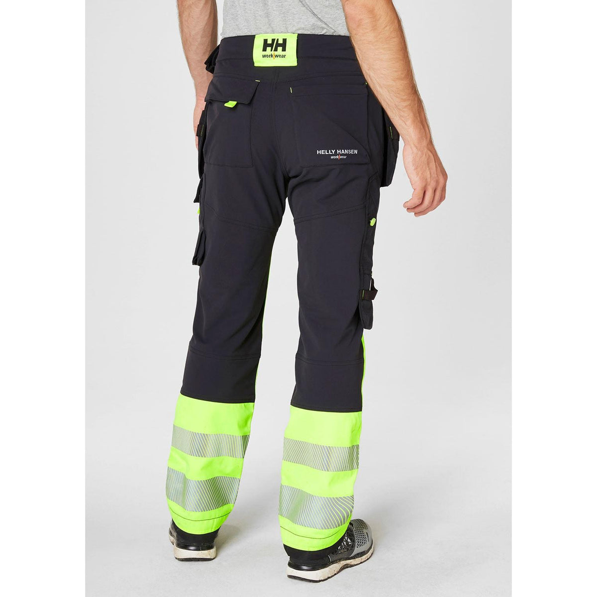 Helly Hansen Work Wear Icu Huomio Riipputaskuhousut 1 Lk. keltainen/harmaa Kestava neljaan suuntaan joustava kangas nayttaa